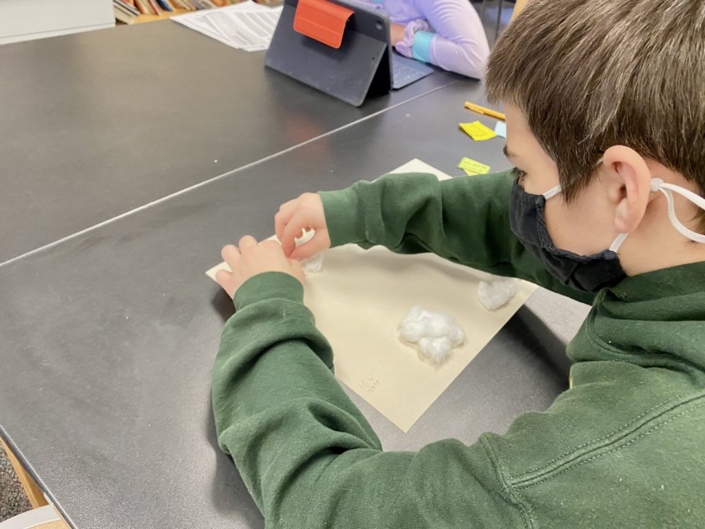 Picture of student making clouds for clouds lesson