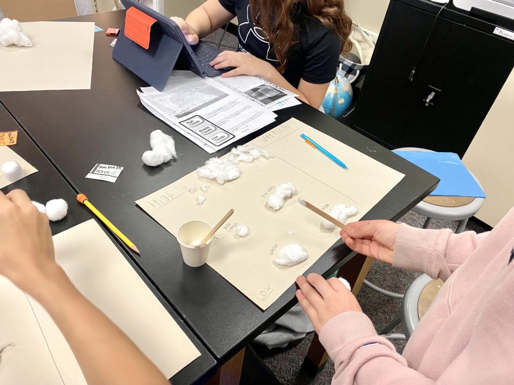 Picture of student creating clouds for clouds lesson