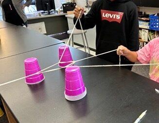 Cup stacking challenge, cup stacking, STEM activity, team building activity, cup stacking game with rubber bands, no hands cup stacking challenge instructions, cup stacking game rules, stacking cup game with timer,