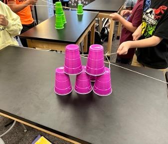 Cup stacking challenge, cup stacking, STEM activity, team building activity, cup stacking game with rubber bands, no hands cup stacking challenge instructions, cup stacking game rules, stacking cup game with timer,