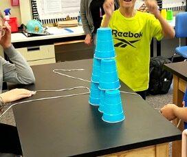 Cup stacking challenge, cup stacking, STEM activity, team building activity, cup stacking game with rubber bands, no hands cup stacking challenge instructions, cup stacking game rules, stacking cup game with timer,